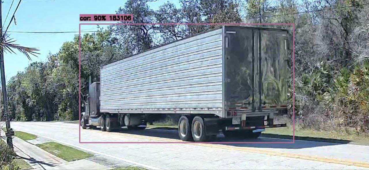 Semi riding on top of yellow center line taking entire road